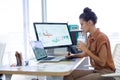 Female executive working over graphic tablet at her desk Royalty Free Stock Photo