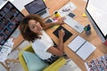 Female executive working over graphic tablet at her desk in office Royalty Free Stock Photo