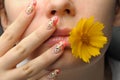 Female face close and nail art