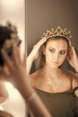 Female Face. Issues affecting girls. Girl princess and reflection in mirror. Woman wear jewelry crown at mirror. Beauty Royalty Free Stock Photo