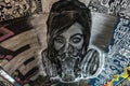 Female face with mask graffiti.