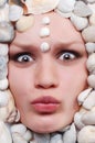 Female face with seashel Royalty Free Stock Photo