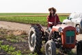 Female farmer driving a tractor