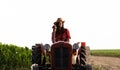 Female farmer driving a tractor