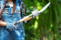 Female farmer hold shovel to do her job in outdoors farm,