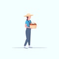 Female farmer holding red ripe tomatoes basket woman harvesting vegetables agricultural worker eco farming concept flat