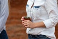 Female farmer holding typical beverage