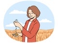 Female farmer inspect crops in field Royalty Free Stock Photo