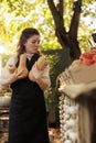 Female farmer selling locally-grown organic produce at local market Royalty Free Stock Photo