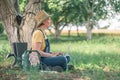 Female farmer using laptop computer in walnut orchard, innovative technology in organic farming Royalty Free Stock Photo