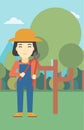 Female farmer using pruner vector illustration.