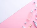 Makeup tools, cosmetics, perfume, creams bottles, Christmas balls on pink white Royalty Free Stock Photo