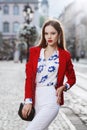 Female fashion concept. Outdoor portrait of a young beautiful confident woman posing on the street. Model wearing Royalty Free Stock Photo