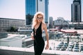 Female fashion concept. Outdoor waist up portrait of young beautiful woman posing on old street. Model wearing stylish clothes, lo