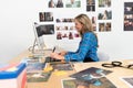 Female fashion designer using graphic tablet at desk Royalty Free Stock Photo