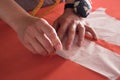 Female fashion designer working with pattern cutting at studio. Royalty Free Stock Photo