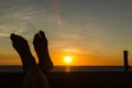 Female feeds towards the sunset. Vacation concept, point of view, Broom, Australia