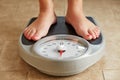 Female feet on a bathroom scale Royalty Free Stock Photo