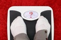 Female feet on bathroom scale Royalty Free Stock Photo