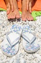 Female feet beach flip flops