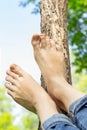 female feet close-up. woman resting in park, lies on grass, took off shoes, with copy space Royalty Free Stock Photo