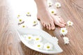 Female feet on the dark floorboard Royalty Free Stock Photo