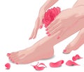 Female feet and hands with pink rose and petals Royalty Free Stock Photo