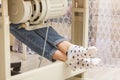 Female feet on the pedal of a sewing machine, motor Royalty Free Stock Photo