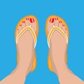 Female feet with red pedicure in summer flip-flops Royalty Free Stock Photo