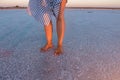 Female feet are on the salty ground Royalty Free Stock Photo