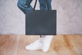 Female feet shopping bag side