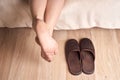 Female feet and slippers Royalty Free Stock Photo