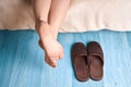 Female feet and slippers Royalty Free Stock Photo