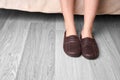 Female feet and slippers Royalty Free Stock Photo