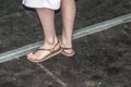 Female feet with slippers standing on a floor Royalty Free Stock Photo