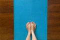 Woman standing on a yoga mat at home Royalty Free Stock Photo