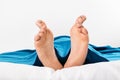 Human feet with smiley and grumpy drawn on them Royalty Free Stock Photo