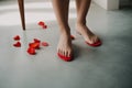 Female feet toenails painted red