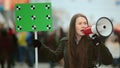 Girl with megaphone scream. Female feminist demonstration. Royalty Free Stock Photo