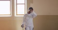 Female fencer athlete during a fencing training in a gym