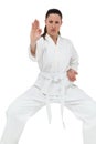 Female fighter performing karate stance Royalty Free Stock Photo