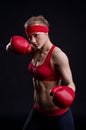 Female fighter in red gloves