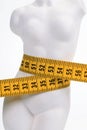 Female figure with a yellow measuring tape Royalty Free Stock Photo