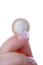 Female finger with one euro coin