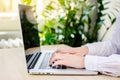 Female fingers on a laptop trackpad close-up