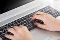 Female fingers typing document on gray laptop with black buttons, feceless portrait of woman working at portable computer, lady Royalty Free Stock Photo