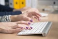 Female fingers typing on keyboard Royalty Free Stock Photo
