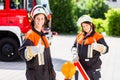 Female fire fighters setting up attention sign