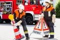 Female fire fighters setting up attention sign Royalty Free Stock Photo