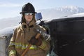 Female Firefighter Holding Axe